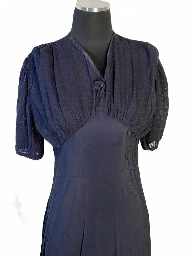 A Dainty Blue 1930s Vintage Dress with a sleeve.