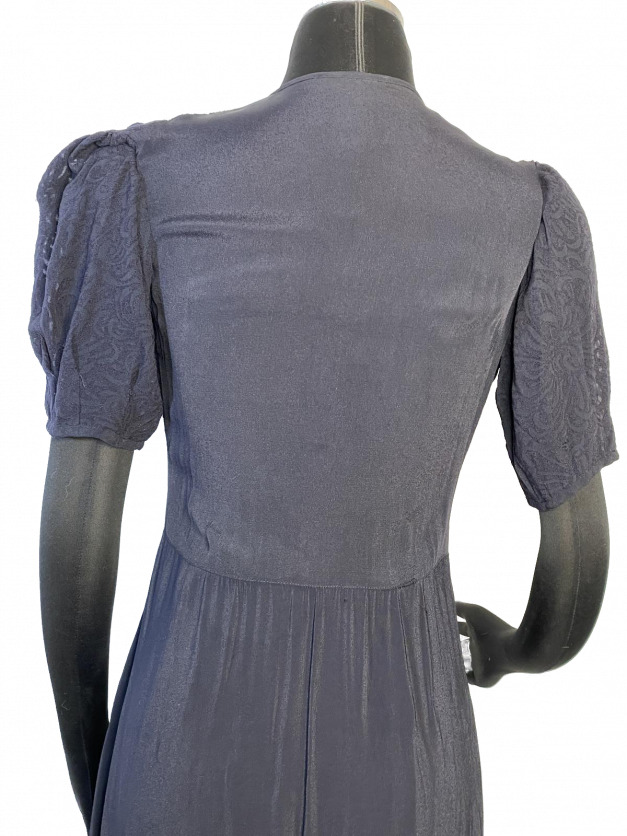 A dainty mannequin showcasing a Dainty Blue 1930s Vintage Dress.