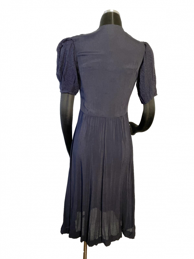 A Dainty Blue 1930s Vintage Dress on a mannequin.