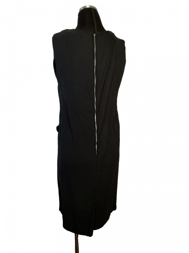 The back of a Little black linen shift mini dress - vintage 1960s on a mannequin.