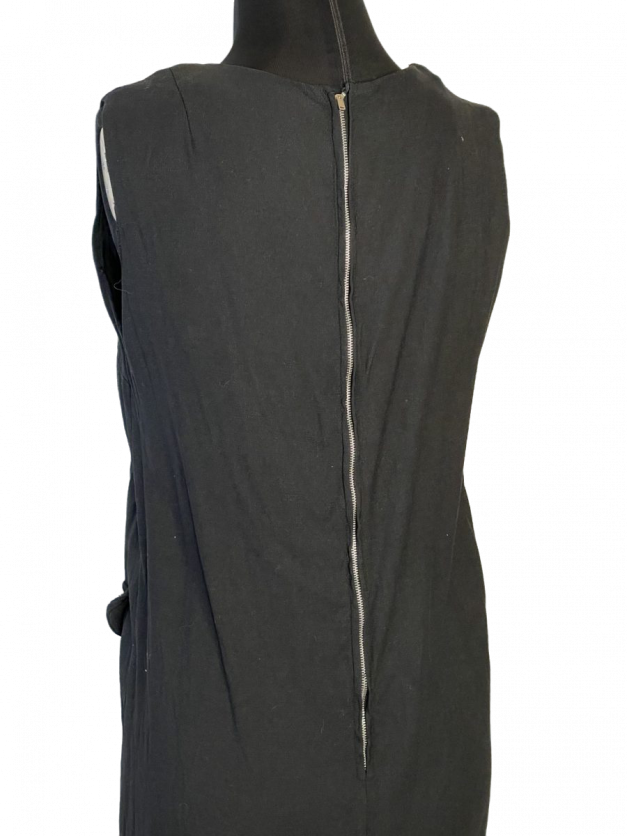A vintage 1960s little black linen shift mini dress with a zipper on the back.
