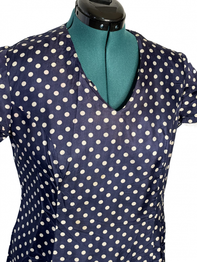 A Blue Polkadot vintage 1950s-60s Pinup-style dress - rare size XXL displayed on a mannequin.