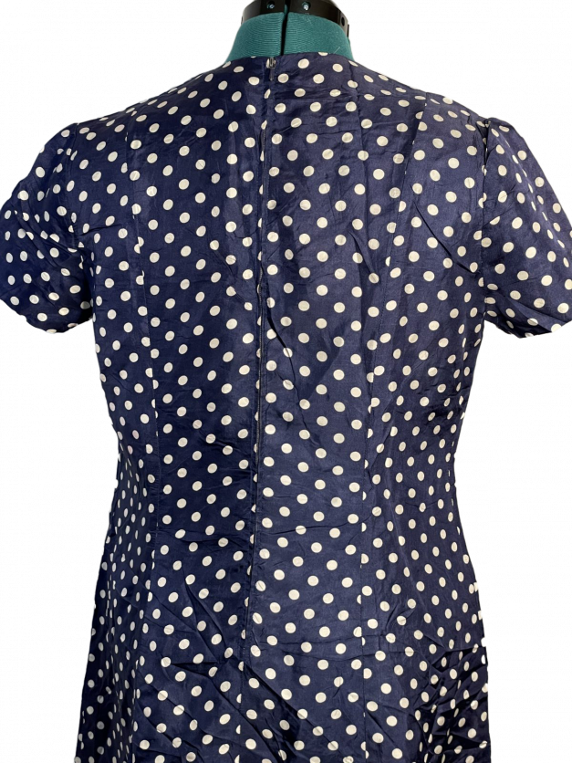 A Blue Polkadot vintage 1950s-60s Pinup-style dress - rare size XXL displayed on a mannequin.