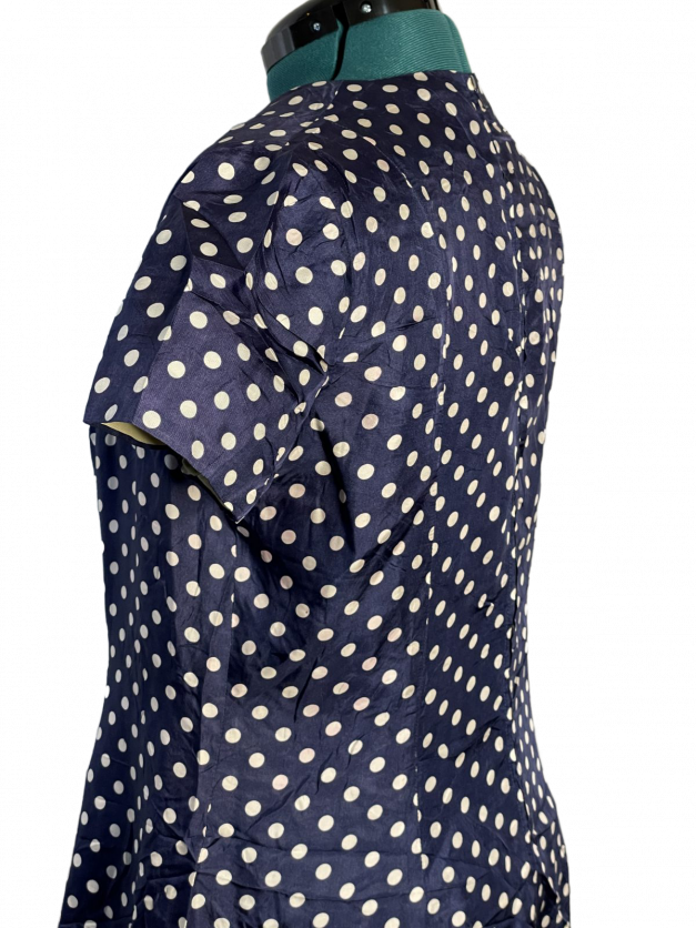 Blue Polkadot vintage 1950s-60s Pinup-style dress for sale - showcasing the back of a woman's outfit.