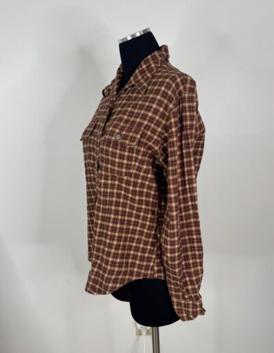 Brown plaid 90s Levi's women's flannel shirt with dagger collar, retro grunge style, medium, on dress form against white wall.