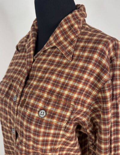 Vintage 90s Levi’s women's plaid flannel shirt in brown, red, yellow; medium, dagger collar, chest pockets on black mannequin.