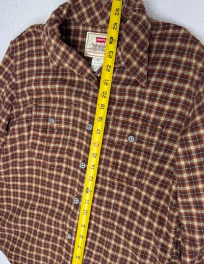 90s Levi's women's medium brown plaid flannel shirt with dagger collar, white buttons, 23" long, retro grunge style.