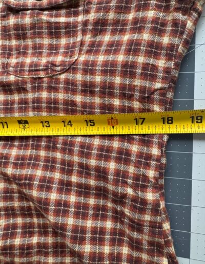 Vintage 90s Levi's red and beige plaid flannel shirt, medium, with chest pocket, button, and brown dagger collar; tape measures 19".