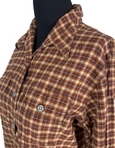 Vintage 90s Levi’s women’s brown plaid flannel shirt, red and cream accents, dagger collar, button chest pockets, retro grunge style.
