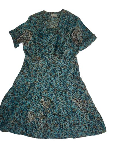Vintage 1940s Clayton New York rayon midi day dress with short sleeves, blue, teal, and brown paisley swirl print, laid flat.