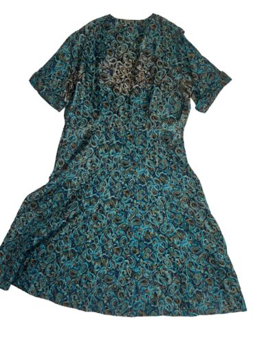 Vintage 1940s Clayton New York rayon dress with teal and black mid-century swirl print, short sleeves, midi length, on white background.