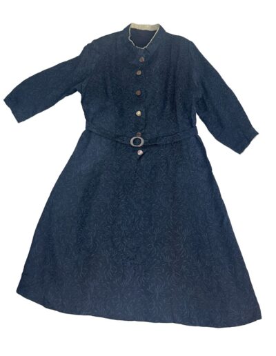 1940s navy blue floral brocade midi dress with mother of pearl buttons, original belt, snap-front, flat on white background.