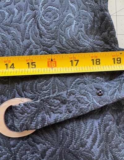 Yellow measuring tape on vintage 1940s handmade navy blue floral brocade fabric, WWII era, mother of pearl buttons, original belt.