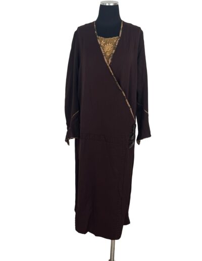 Rare plus size antique 1920s dark brown drop waist flapper dress with gold-patterned panel, Art Deco trim, on dress form.
