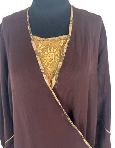 Rare Plus Size Antique 1920s dark brown drop waist dress with Art Deco embroidery, floral trim, and gold lace sunburst neckline.
