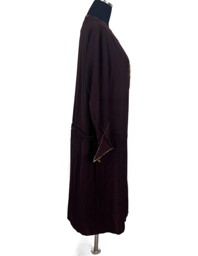 Plus size antique 1920s dark brown drop waist dress with Art Deco embroidery, tubular flapper silhouette on dress form, white backdrop.
