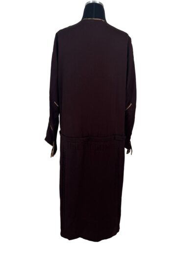 Plus size 1920s dark brown Art Deco drop waist dress with embroidery, long sleeves, and straight tubular fit on mannequin back view.