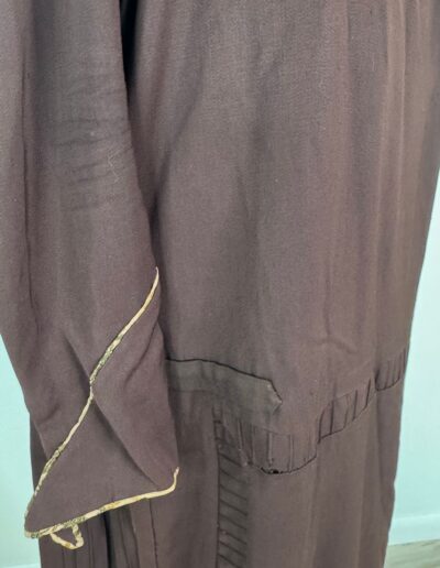 Rare plus size antique 1920s dark brown drop waist dress with gold sleeve trim, pleated hem, Art Deco flapper style.