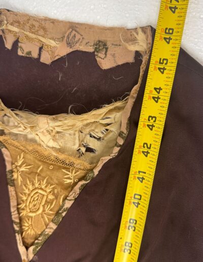 Rare plus size 1920s dark brown drop waist dress, Art Deco lace, frayed neckline, yellow measuring tape beside XL 1X.