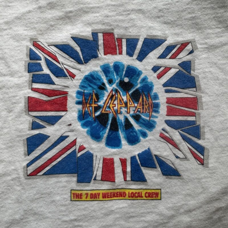 Vintage Def Leppard T-shirt with a shattered Union Jack, blue tie-dye center, and yellow 7 Day Weekend Tour crew bar.