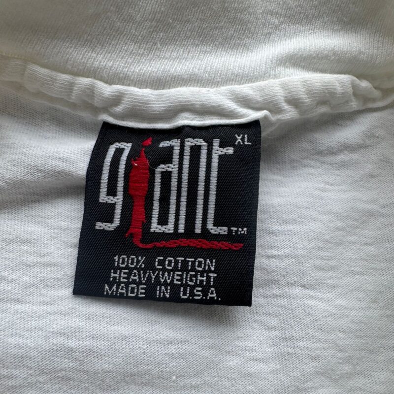 Black tag with “giant XL” and red graphic on a white vintage Def Leppard 100 cotton heavyweight crew shirt, early ’90s style.