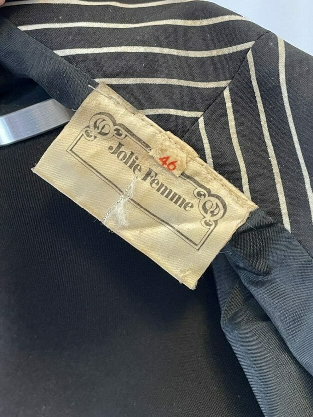A Cute Classic Long Sleeve Vintage Pinstripe Dress with a cute label on it.