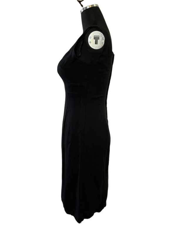 A Sexy little black dress vintage 1950s sheath adorns a mannequin dummy.