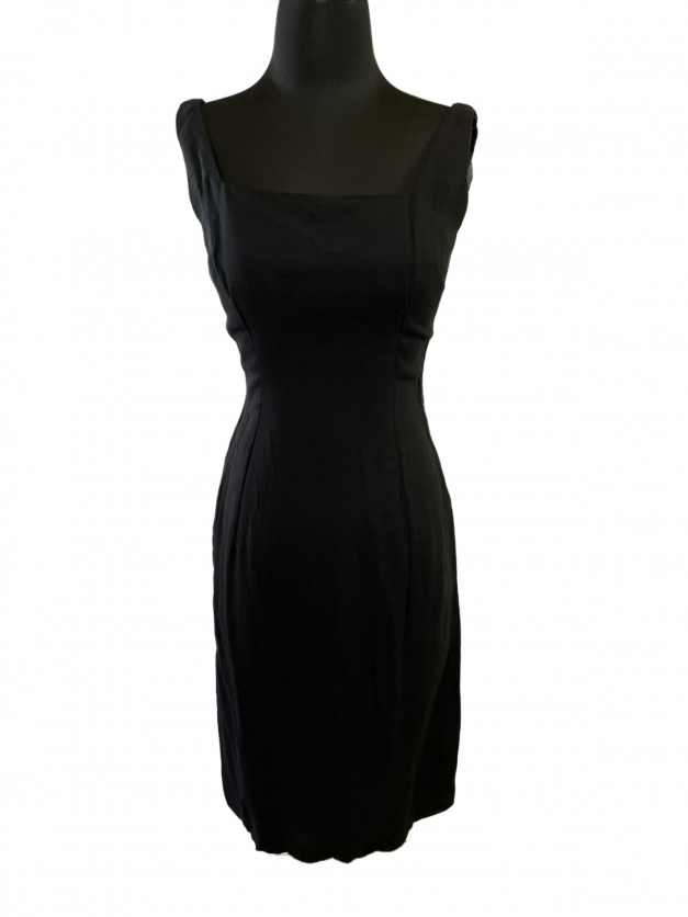 A sexy little black dress vintage 1950s sheath on a mannequin dummy for sale.