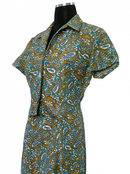 A Vintage 1970s green paisley dress with a paisley print.